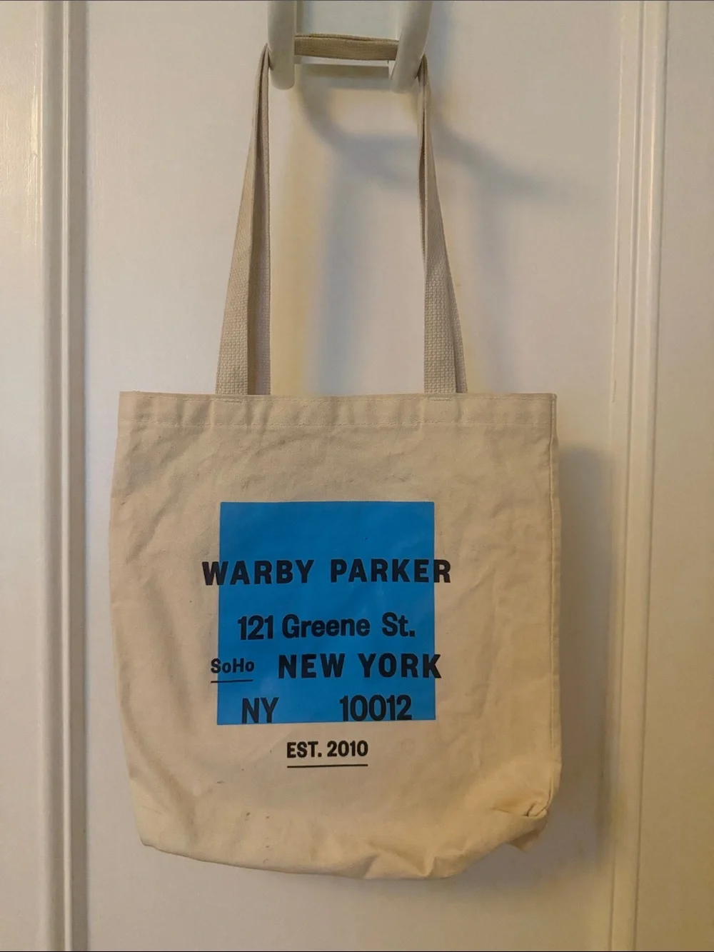 Warby Parker Cream Canvas Tote with Bright Blue Graphic
